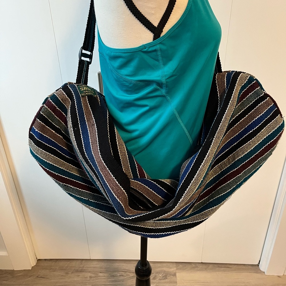 Yoga mat/accessories bag with crossbody strap.